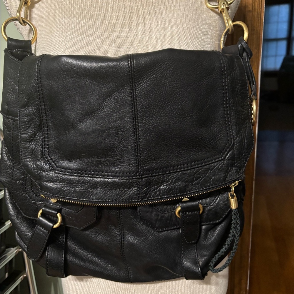 The Sak Chic Black Pebbled Leather Shoulder Bag with Gold Accents